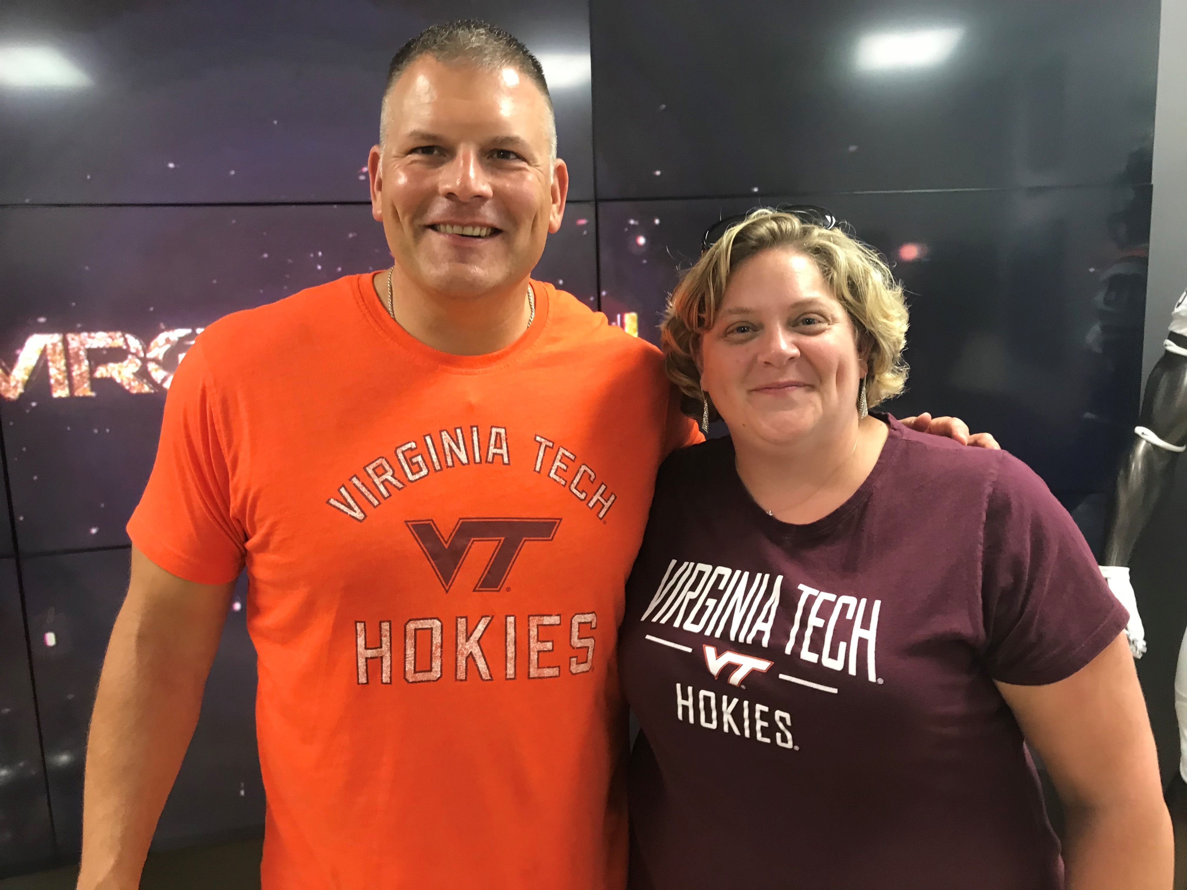 A huge Virginia Tech football fan, Aurda is pictured here with coach Justin Fuente.