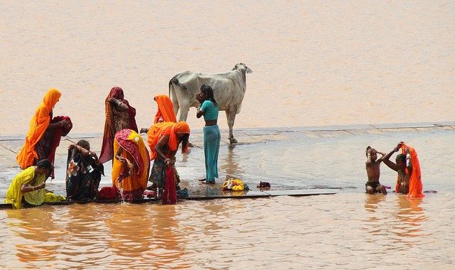 people bathing in the river in Pushkar