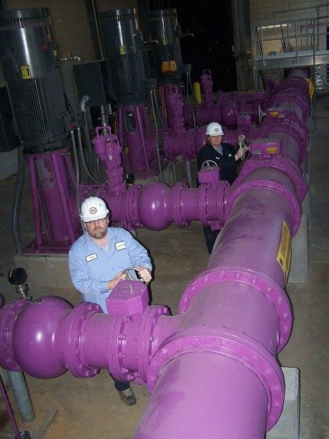men working on pipes