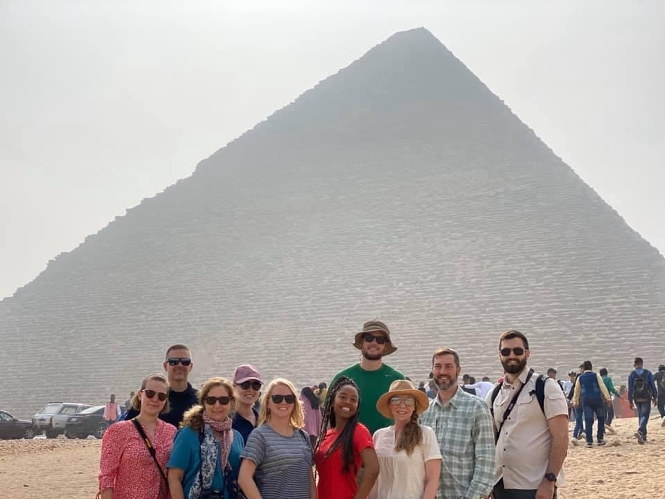 Jeff Merritt, back row first on the left, with some of the XMNR19 students visiting the Giza Pyramids outside Cairo, Egypt