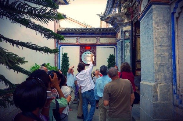 people exploring a chinese building exterior