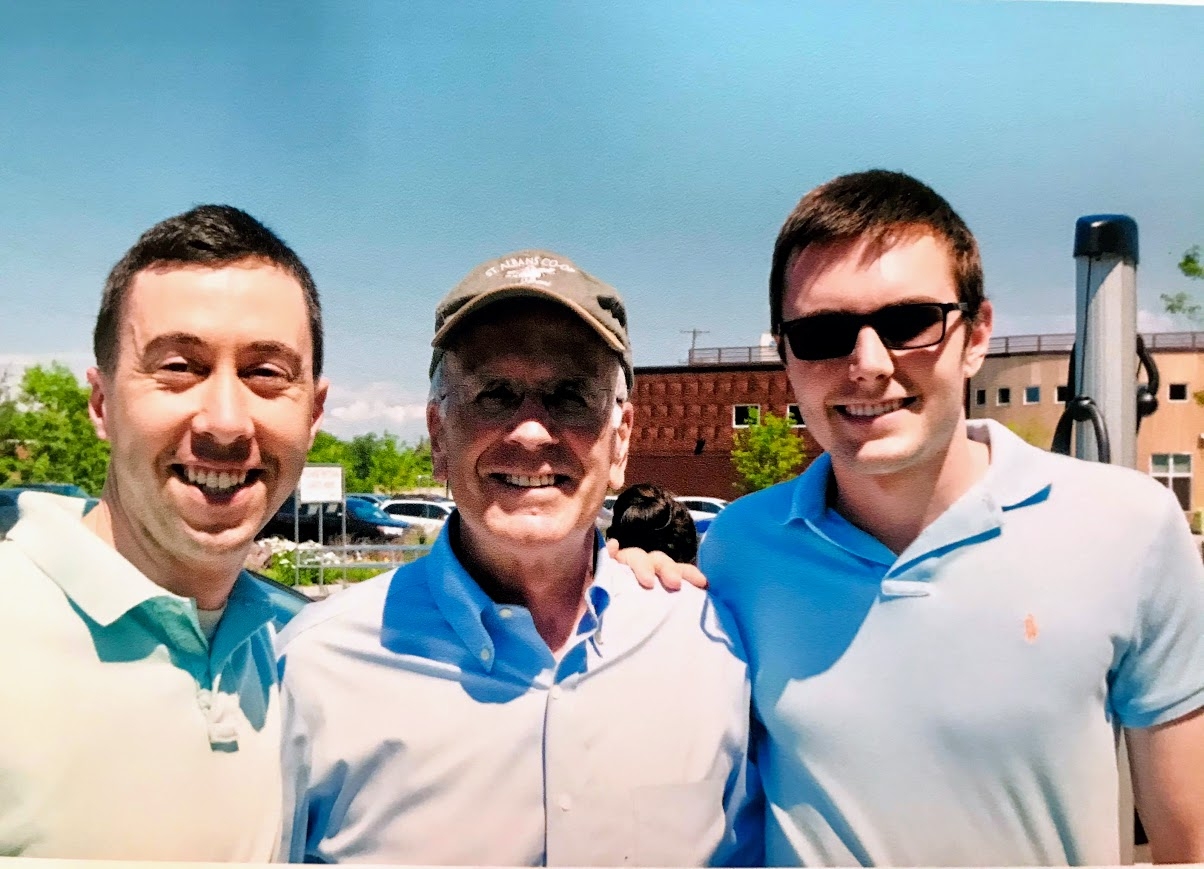 Marshall (right) pictured with coworker Jason Charest (left) and U.S. Congressman Peter Welch (center) after participating in a press conference to unveil legislation to extend and improve tax credits for electric vehicles and charging infrastructure.