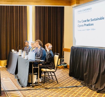 group of people presenting at conference 