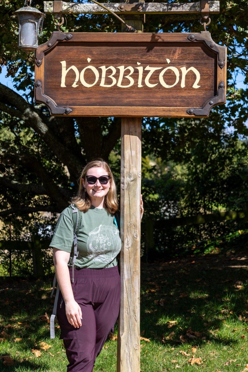 online master of natural resources olivia powell in front of hobbiton sign
