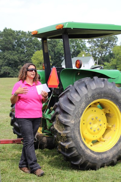 Woman by a tractor