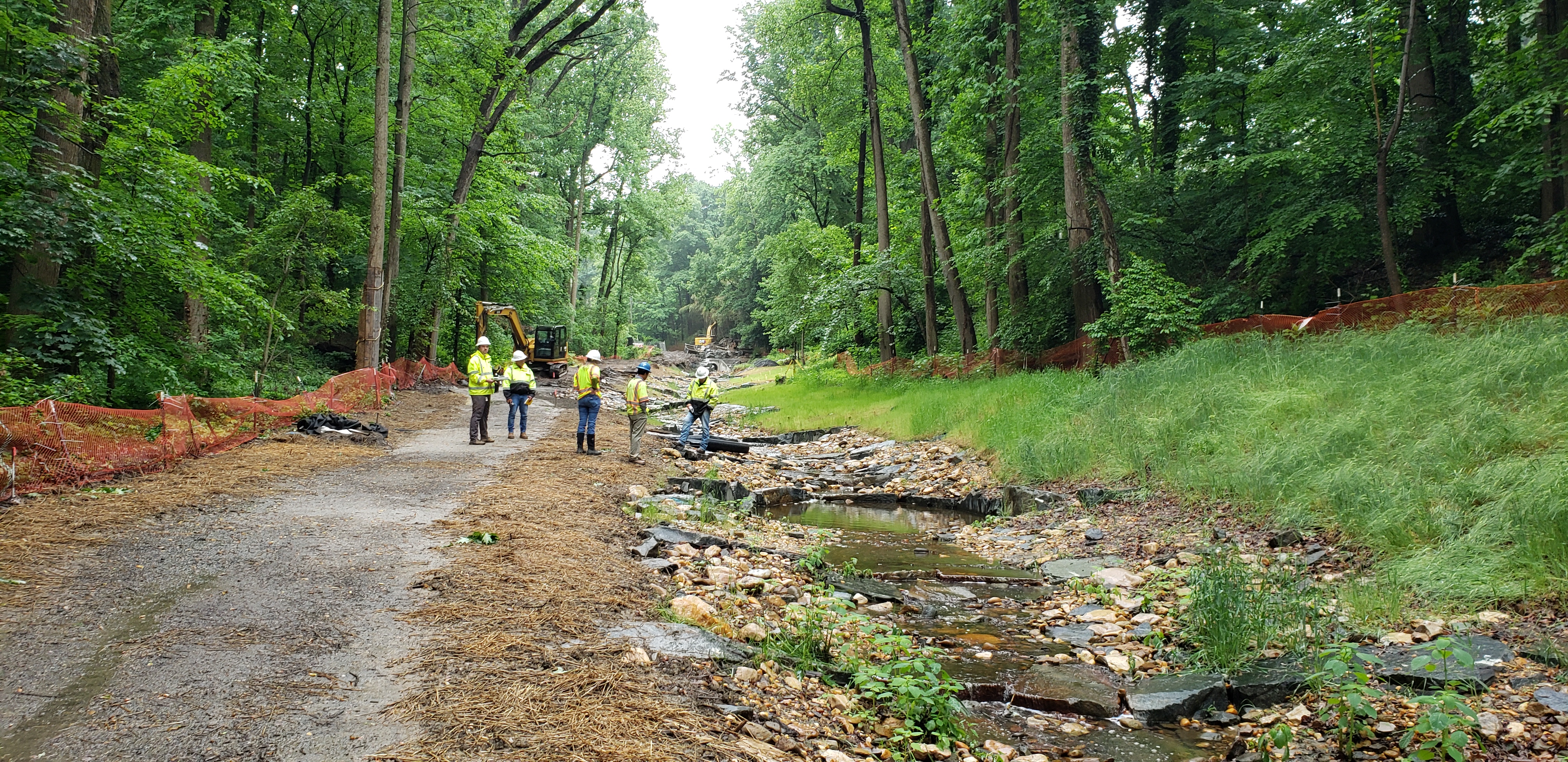 The Arlington County Government began construction on a stream resilience project in 2021. Here, the project manager, design engineer, construction manager, and contractor evaluate progress. Photo by Jason Papacosma