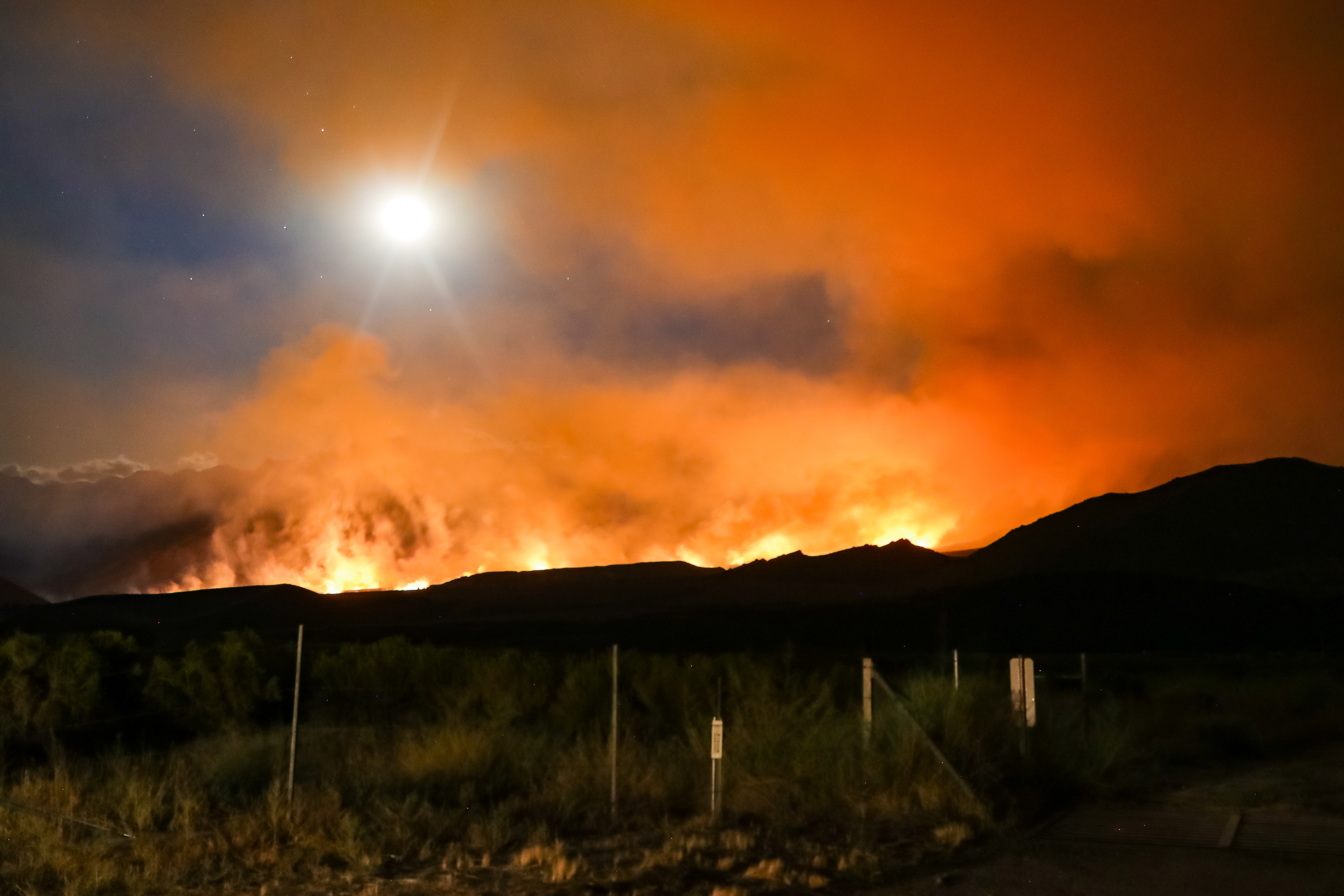 California wildfire with glowing orange smoke in the Sierra Nevada mountains. Photo: Ross Stone on Unsplash 
